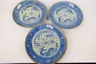 Three Chinese blue and white plates with fluted rim,