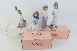 Nao - A group of Nao figures, part boxed, largest approximately 26 cm (h).