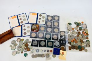 A collection of coins and commemoratives, Victorian and later, some silver content noted.