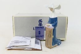 A boxed Lladro figure depiction a praying nun, # 5502 Mediation [sic] (Blue),