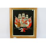 A British naval embroidery comprising Royal Coat Of Arms imposed before a three masted ship with