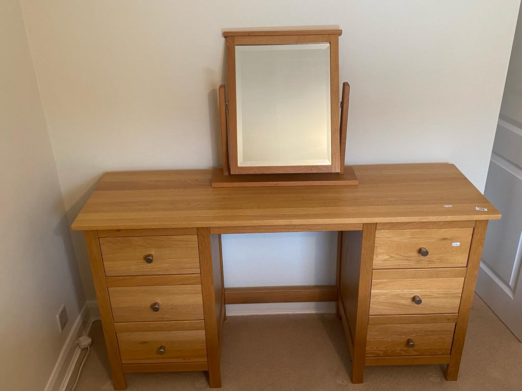 A Corndell Furniture Co dressing table with swing mirror and three drawers to each side,