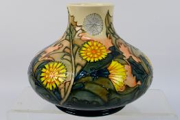 Moorcroft - A limited edition Moorcroft Pottery vase of squat baluster form,
