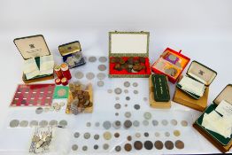 A collection of various UK and foreign coins, commemoratives and similar, some silver content noted.