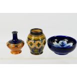 A group of small ceramic pieces to include a Moorcroft Pottery bowl decorated to the interior with