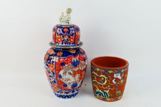 A large imari ribbed jar and cover with shishi finial,