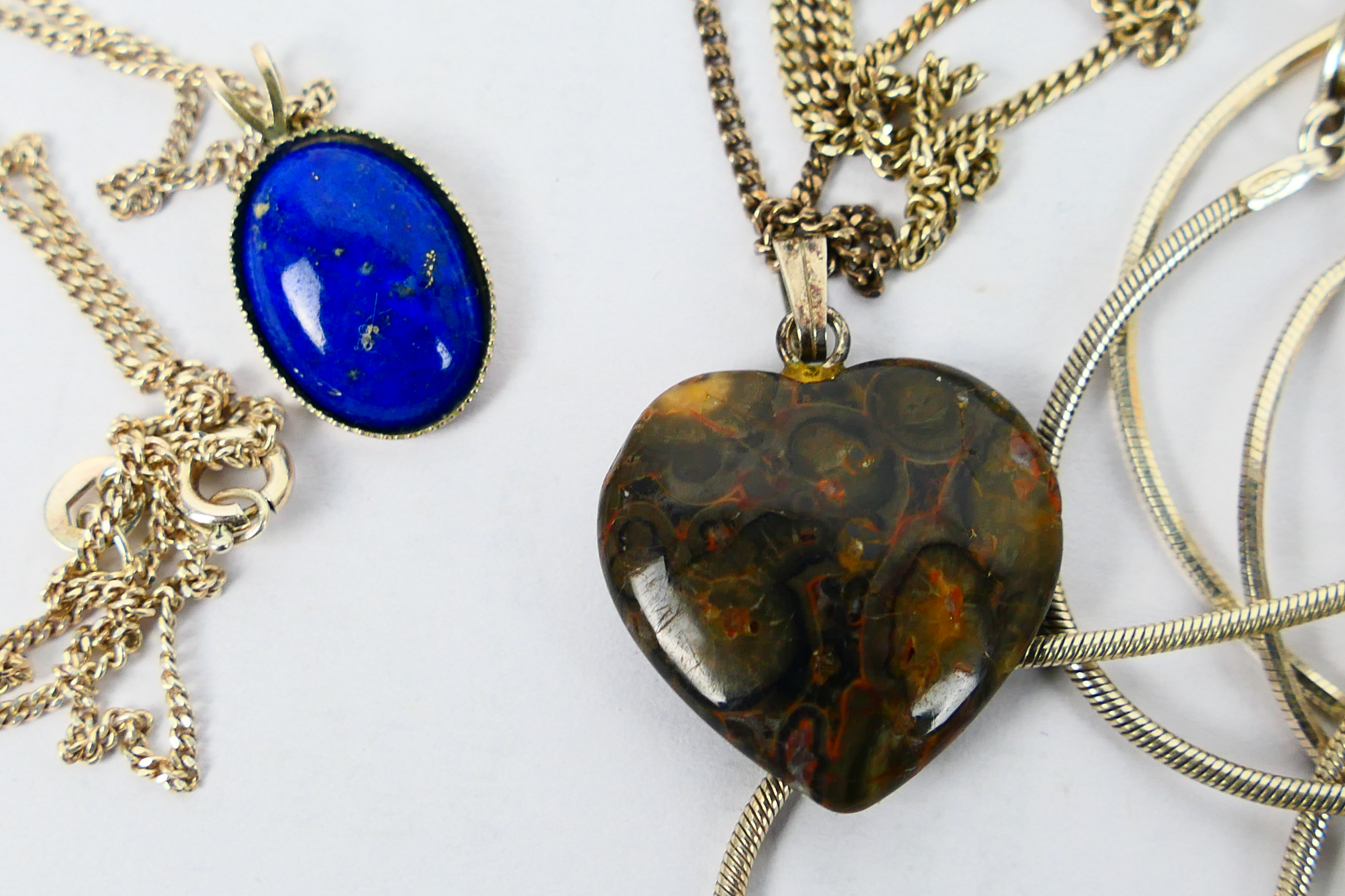 A collection of necklaces and pendants, predominantly stamped 925 with one amber chip example. - Image 2 of 6