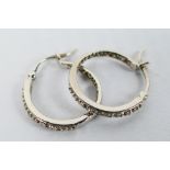 A pair of 9ct white gold, stone set ear hoops, approximately 2.7 grams.