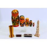 A set of Russian president matryoshka dolls, two wood and white metal snuff boxes,