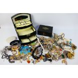 A collection of costume jewellery to include brooches, rings, necklaces,