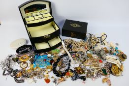 A collection of costume jewellery to include brooches, rings, necklaces,