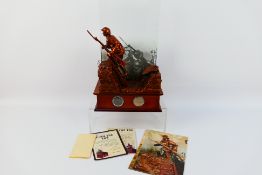 Danbury Mint - A bronzed sculpture Over The Top depicting a British soldier leaving the trench into