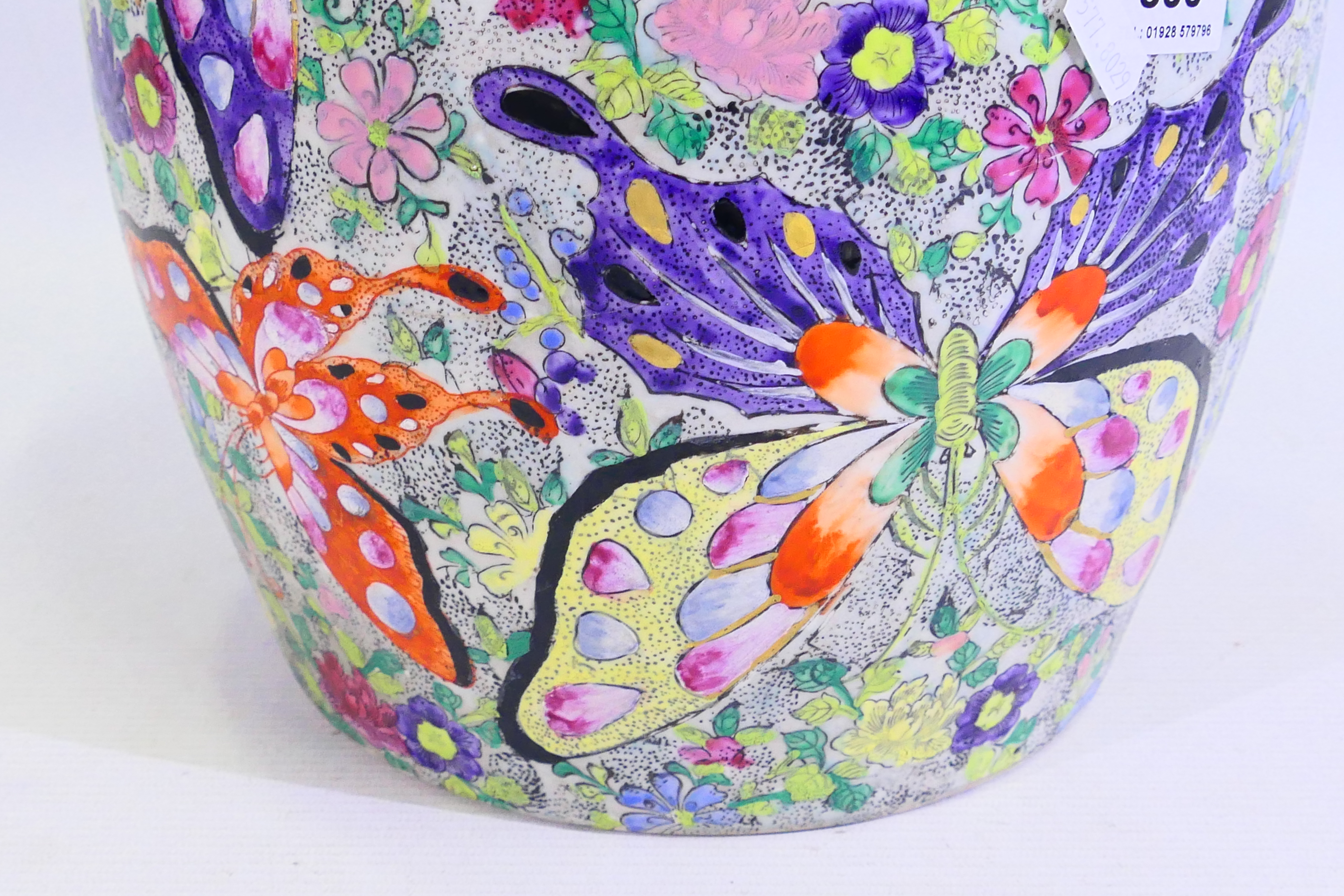 A large Japanese vase decorated with numerous butterflies amidst flora, signed to the base, - Image 5 of 14