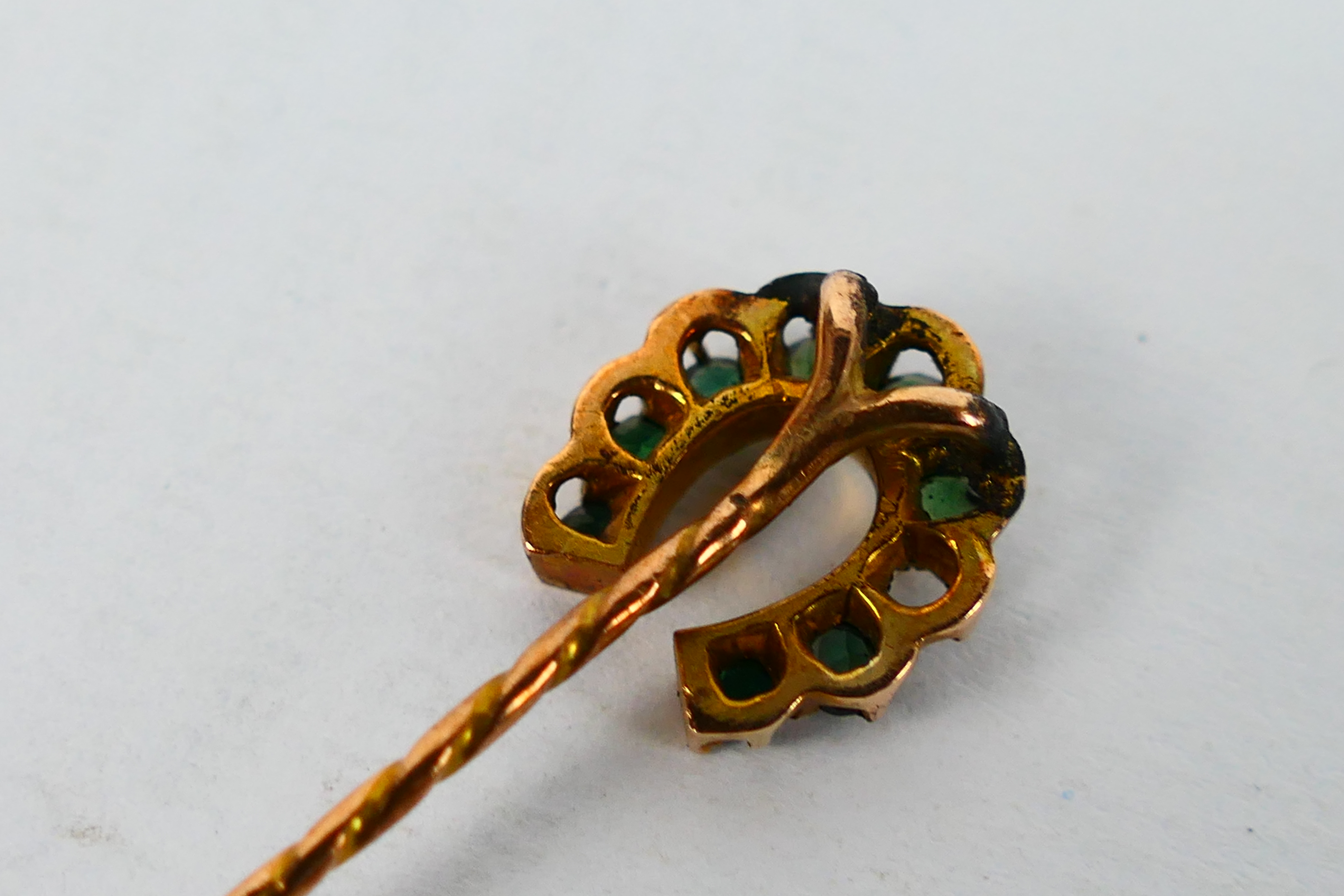 A yellow metal bar brooch with central floral motif, - Image 5 of 5
