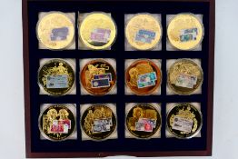 A set of British Banknote Collection commemorative coins comprising twelve gold plated coins each