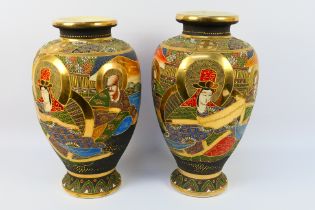 A large pair of Satsuma vases of inverted baluster form, decorated with figures and landscape,