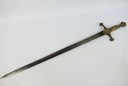 A 19th century band sword with 65 cm (l) with twin fullers, the hilt with scroll decoration,