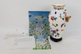 A Franklin Mint Vase Of A Hundred Butterflies, designed by Mei-Lin Li, approximately 30 cm (h),