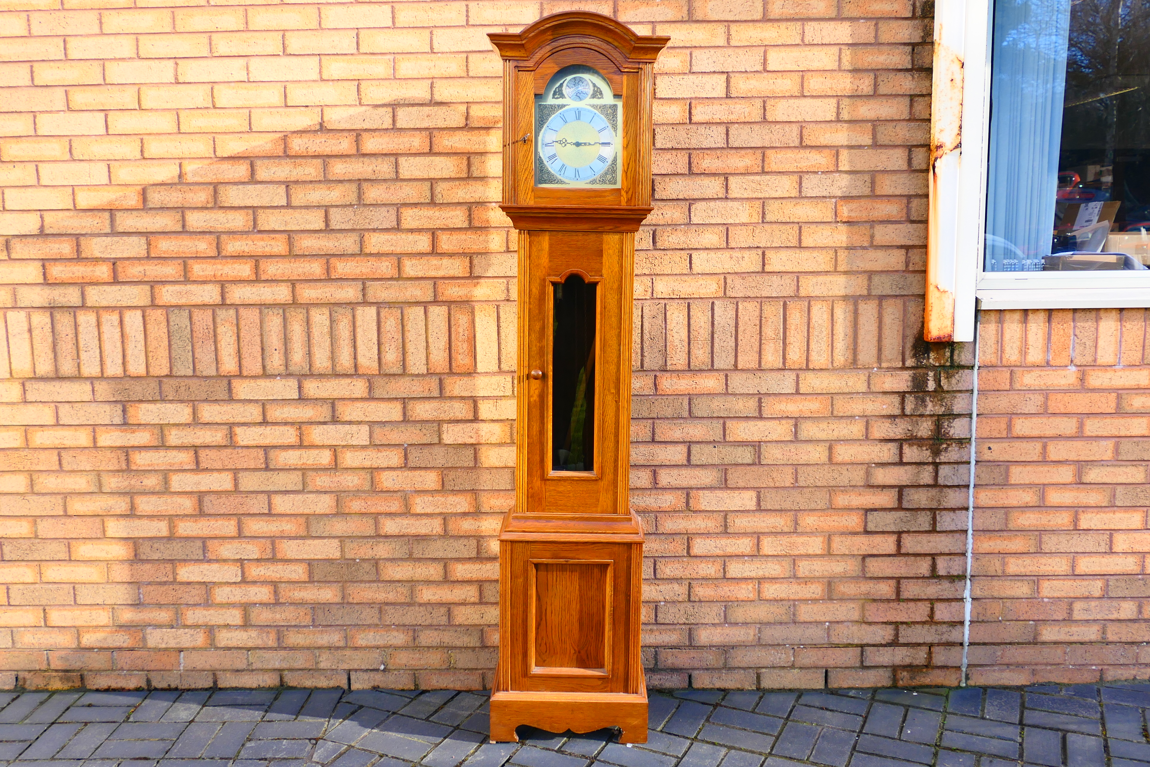 A modern oak cased longcase clock, 10" brass dial marked Tempus Fugit,