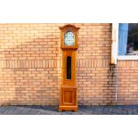 A modern oak cased longcase clock, 10" brass dial marked Tempus Fugit,