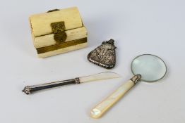 Lot to include a magnifying glass with mother of pearl handle, bone trinket box,