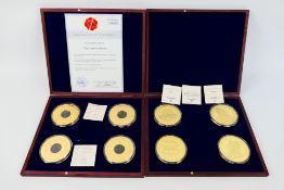 Lot to include two Windsor Mint coin sets including Gold Giants comprising four 24k gold plated