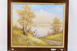 An oil on canvas landscape scene depicting two young girls by a lakeside, signed lower left, framed,