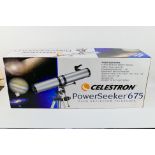 A boxed Celestron PowerSeeker 675 telescope.