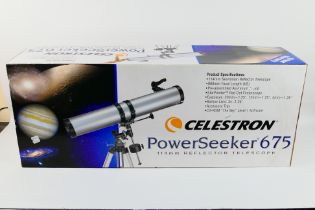 A boxed Celestron PowerSeeker 675 telescope.