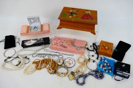 A collection of costume jewellery to include earrings, necklaces and similar.