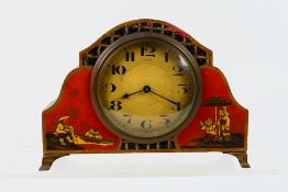 An early 20th century Asprey of London chinoiserie mantel clock, Arabic numerals to a white dial,