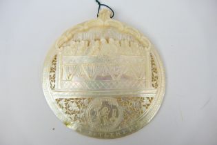 A late 19th or early 20th century Holy Land carved and pierced shell,