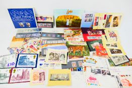 Lot to include a small quantity of mint stamps, loose used stamps, tea card albums,