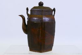 A hexagonal section metal teapot and cover with cane wrapped handle, 16 cm (h).