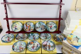 A quantity of boxed collector plates to include a set of twelve Beauties Of The Red Mansion with a
