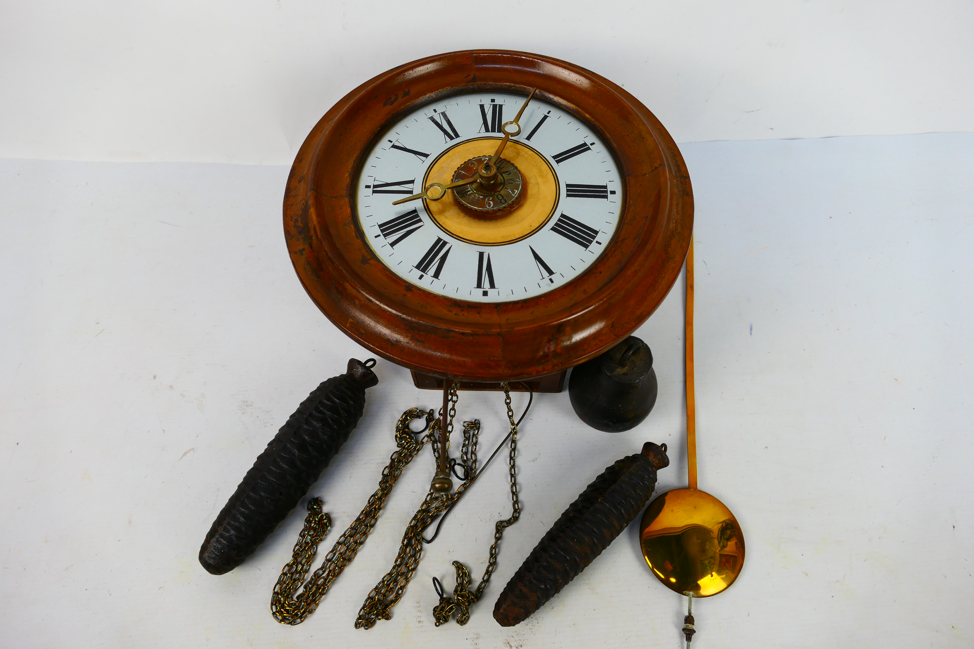 A good example of a 'postman's alarm' wall clock,