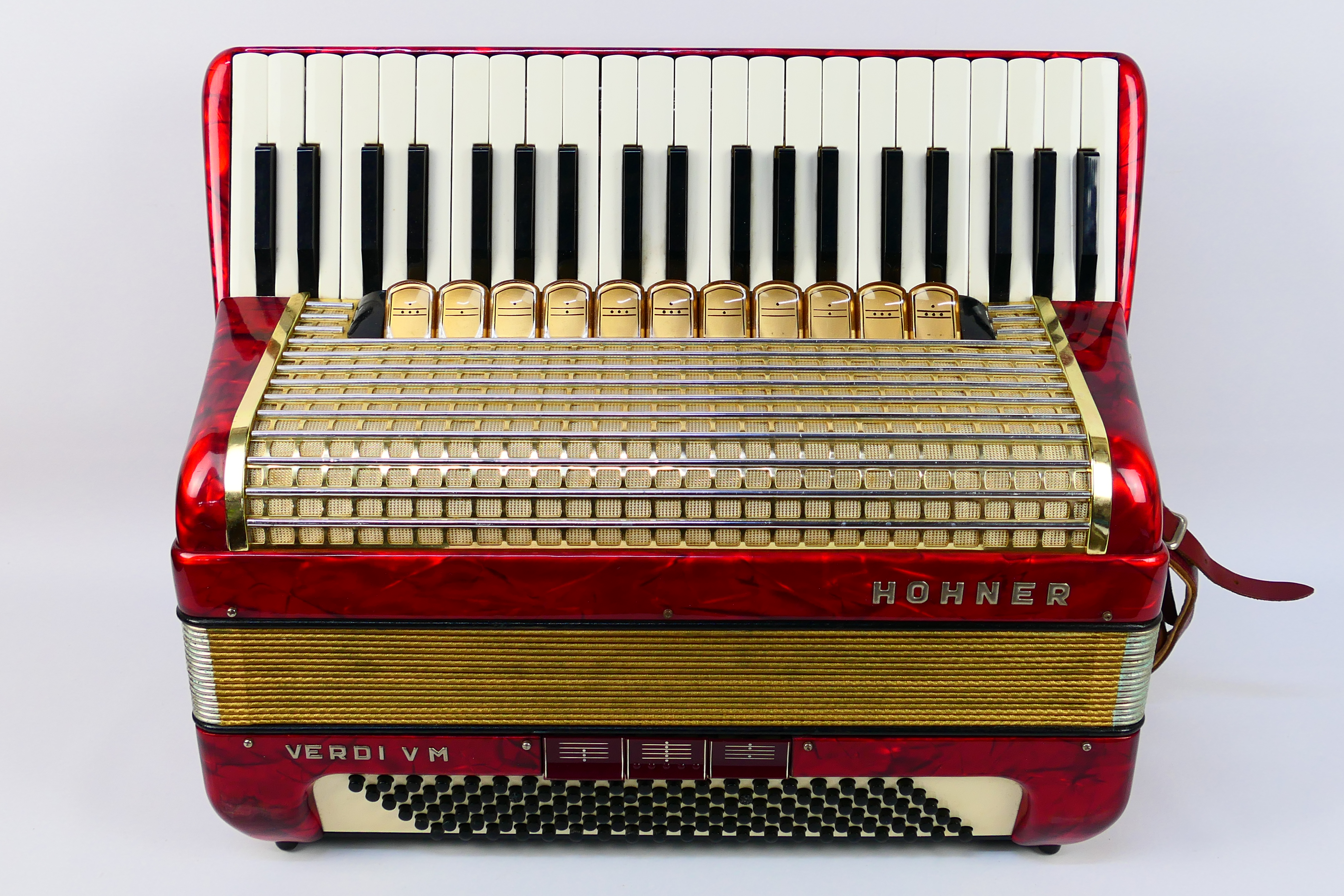 A vintage Hohner Verdi VM piano accordion, 41 keys and 120 basses, marbled red finish,