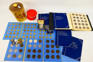 A coin collectors album containing UK and foreign coins, a small quantity with silver content,