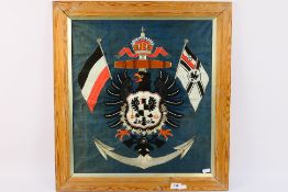 An Imperial German naval embroidery on silk extensively worked with silver bullion,