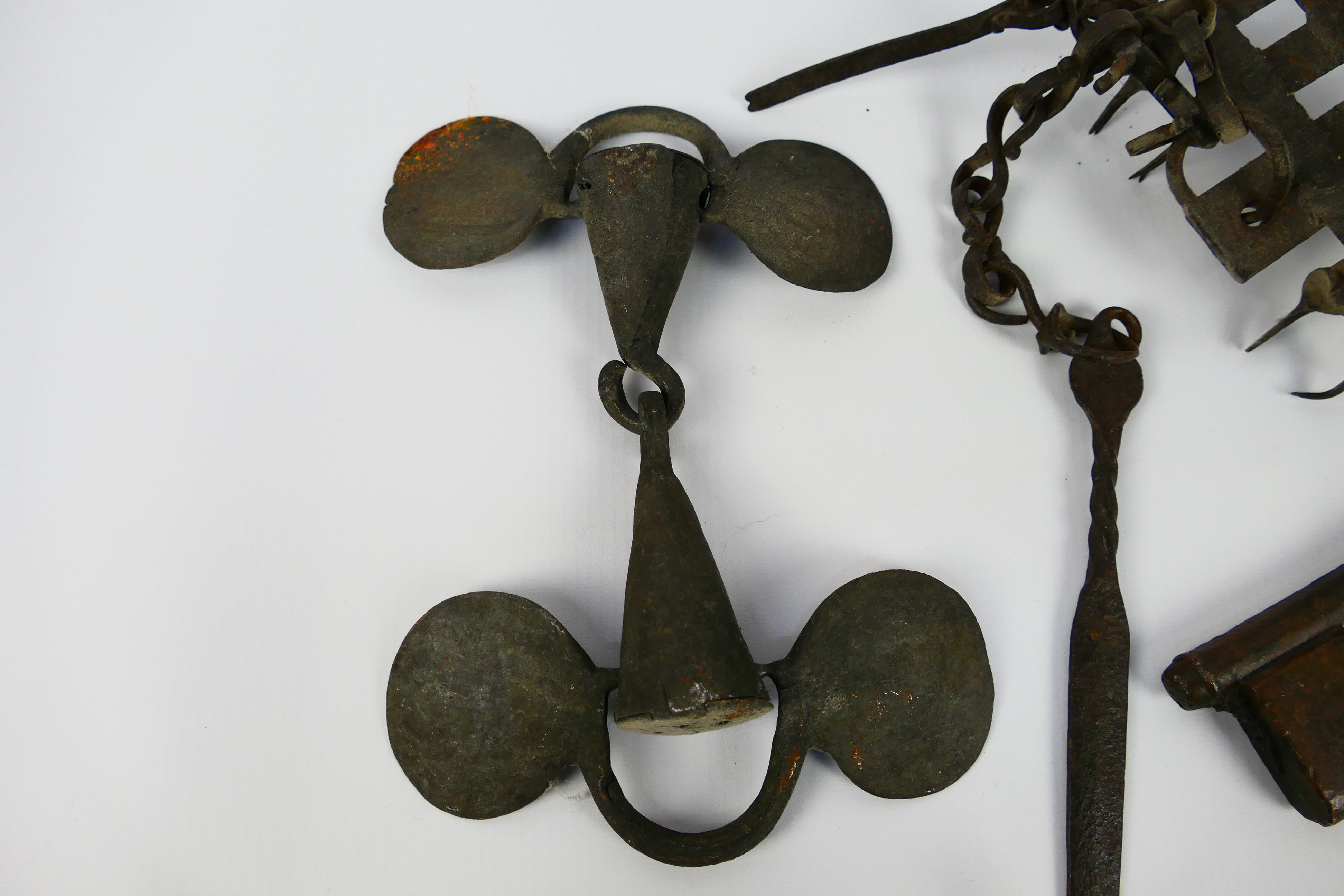 An 18th or 19th century iron oil burner, large bronze key and antique cast iron snaffle bit. - Image 3 of 4