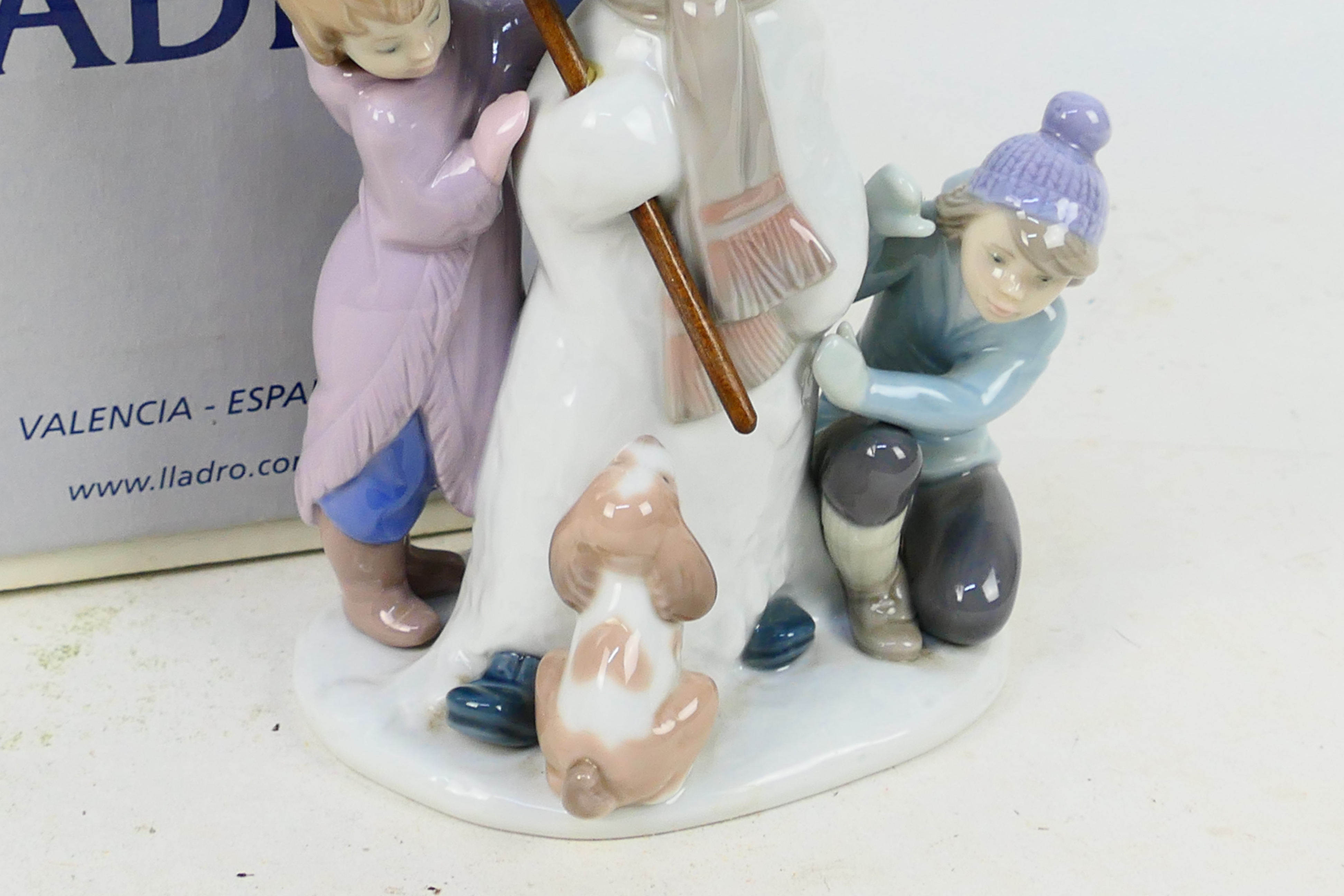 Lladro - A boxed figure group entitled The Snow Man, # 5713, depicting children building a snowman, - Image 4 of 7