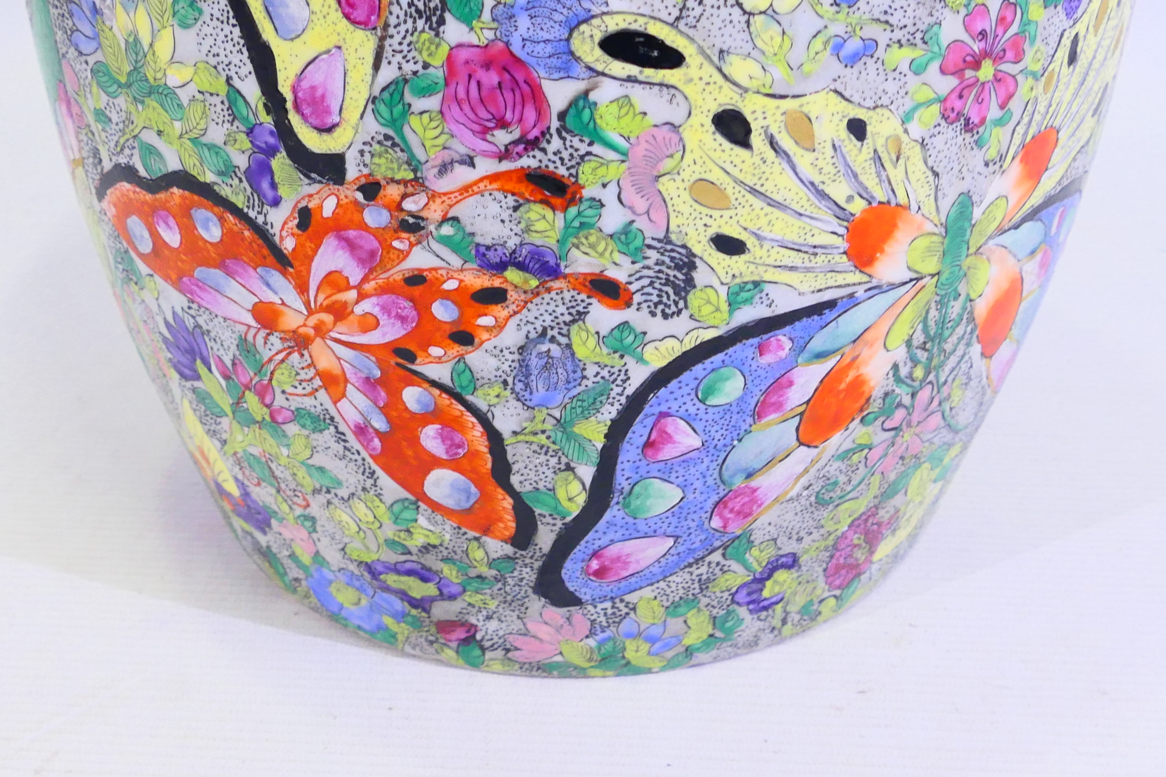 A large Japanese vase decorated with numerous butterflies amidst flora, signed to the base, - Image 9 of 14