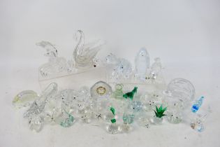 Lot to include Swarovski and similar style ornaments, paperweight and other.