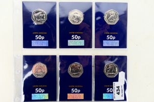 A set of six uncirculated 2020 fifty pence / 50p coins with images of dinosaurs,