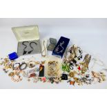 A collection of costume jewellery to include necklaces, brooches, rings, earrings, bracelets,