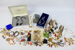 A collection of costume jewellery to include necklaces, brooches, rings, earrings, bracelets,