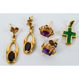 A yellow metal and emerald crucifix pendant, stamped 375 and two pairs of yellow metal earrings,