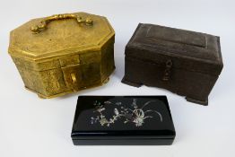 An Asian brass casket, approximately 15 cm x 21 cm x 17 cm, one further similar iron example,