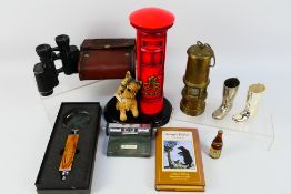 A mixed lot to include binoculars, perpetual calendar,