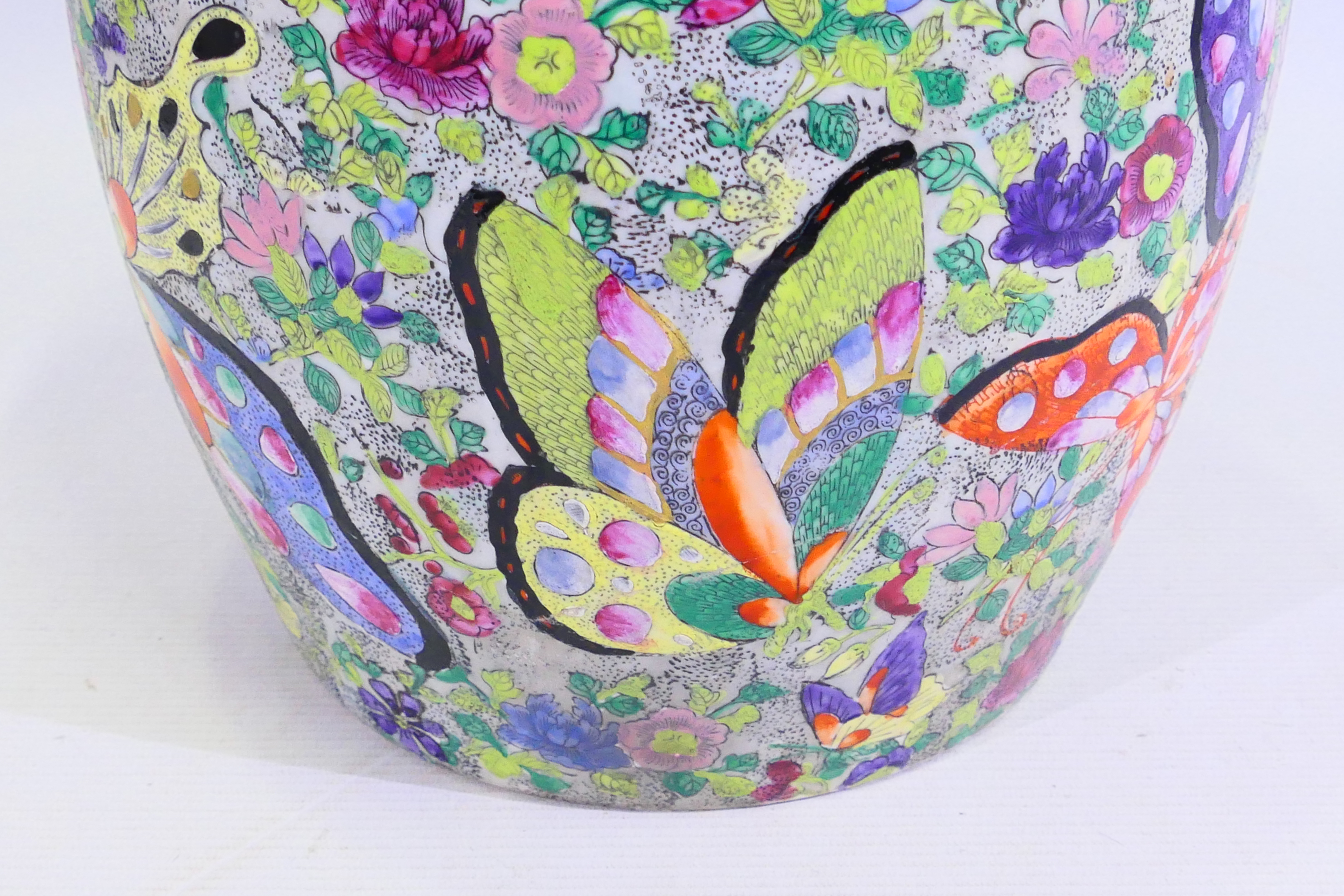 A large Japanese vase decorated with numerous butterflies amidst flora, signed to the base, - Image 3 of 14